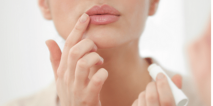 applying tallow lip balm