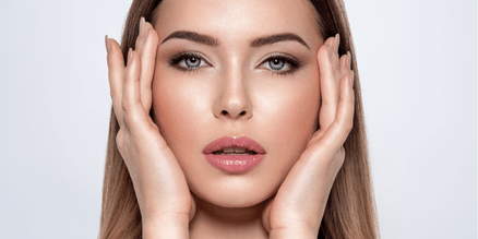 woman's holding her face with hands