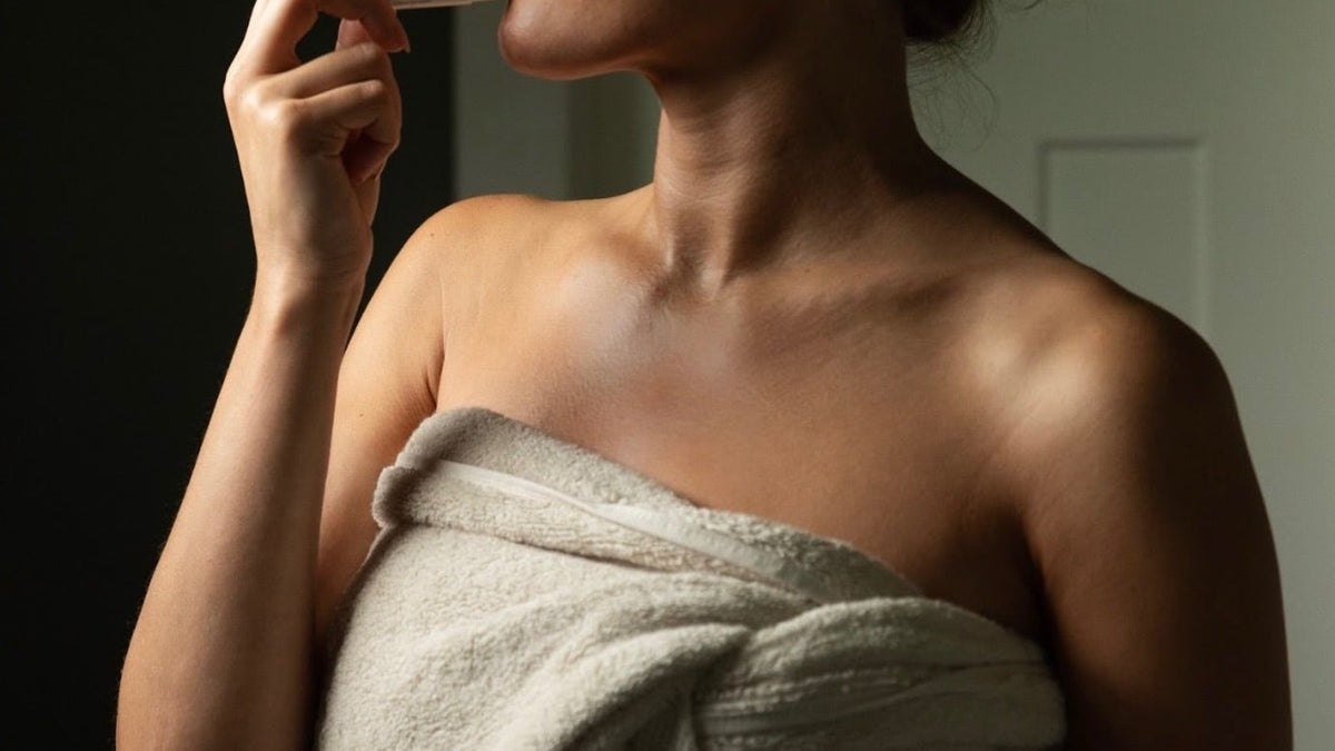 Organic beef tallow lip balm for sensitive skin: woman wrapped in a towel applying tallow lip balm