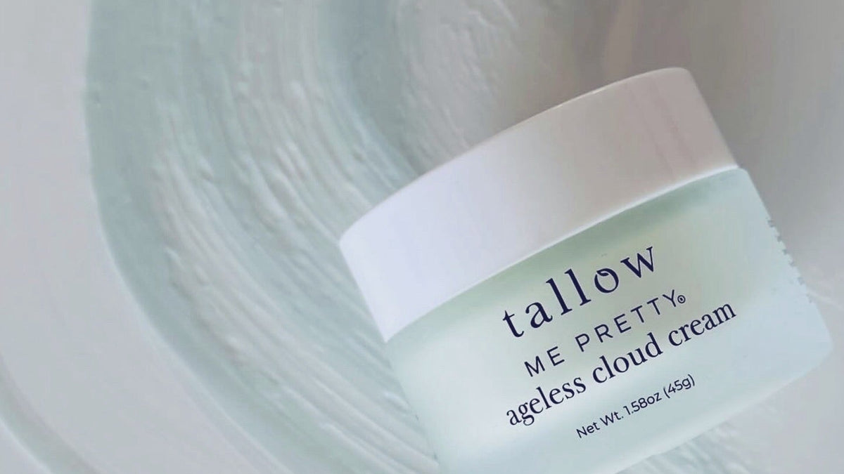How to apply tallow balm: Tallow Me Pretty Ageless Cloud Cream jar on a swirl of blue tallow cream