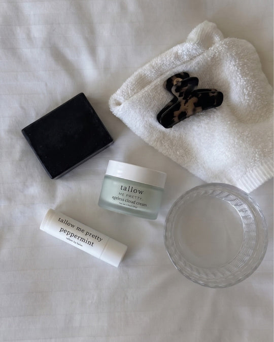 Ancestral skincare and the tallow movement: tallow facial bar, Ageless Cloud Cream and peppermint lip balm on white linens