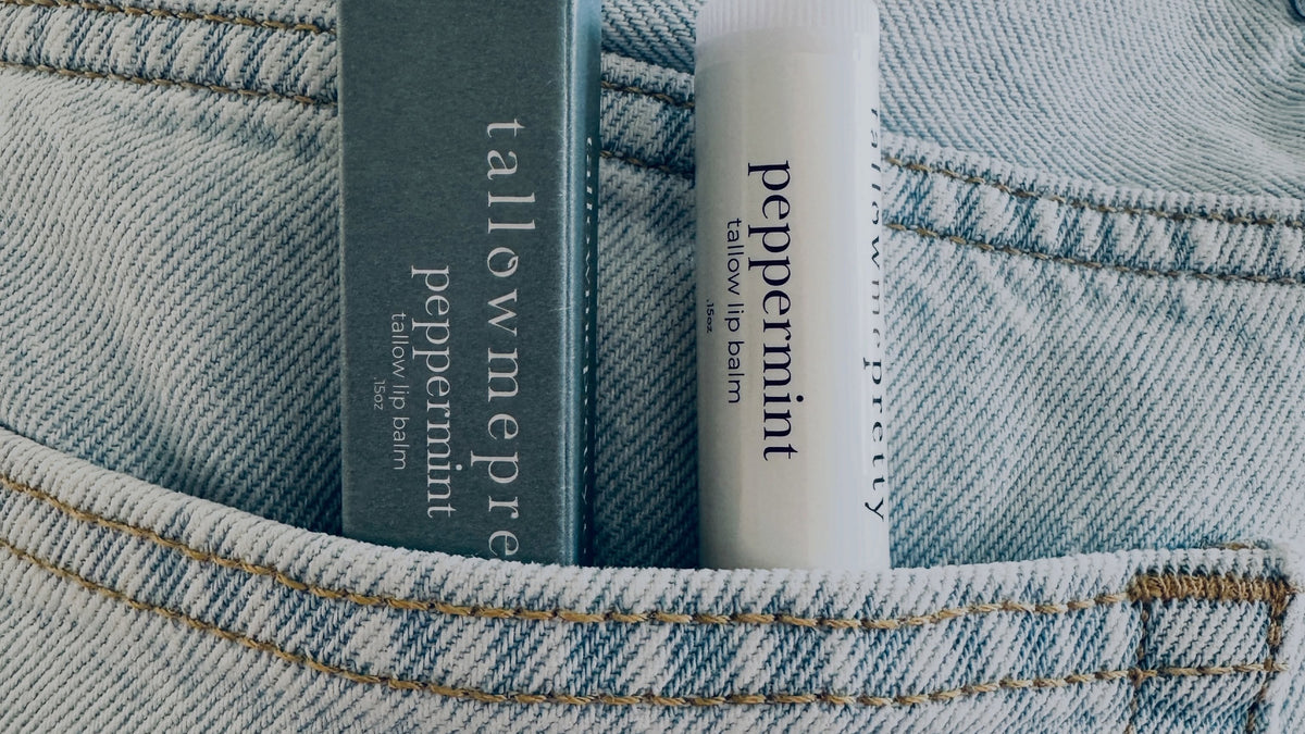Beef tallow chapstick: Peppermint tallow lip balm and its box tucked in a denim pocket