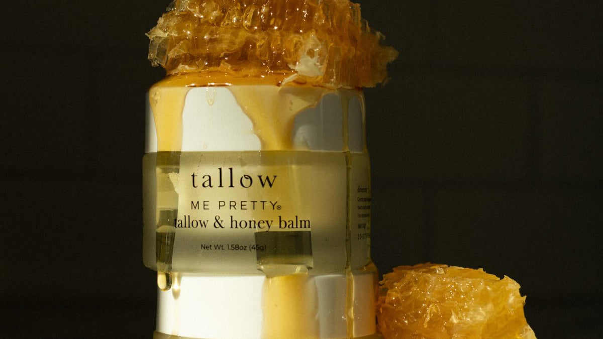 Whipped beef tallow honey balm: stacked jars of Tallow and Honey Balm topped with dripping honeycomb