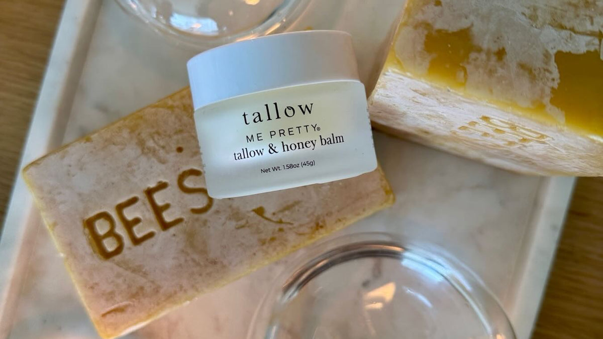 Honey and tallow balm: Tallow and Honey Balm on a tray with beeswax bars and candles