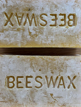 Beef tallow, beeswax and honey: close up of stamped organic beeswax blocks