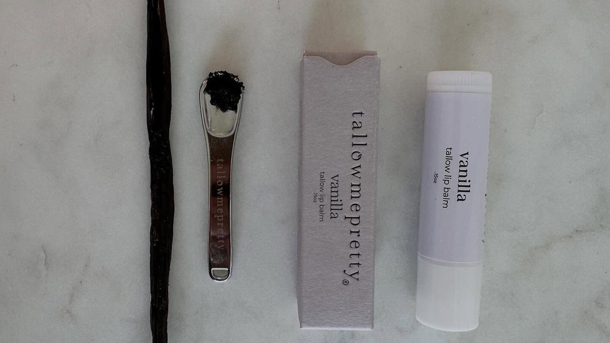 Tallow lip balm benefits: Vanilla tallow lip balm with a vanilla bean on marble