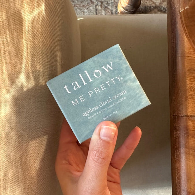 Does tallow help wrinkles: hand holding an Ageless Cloud Cream box