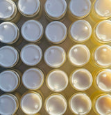 Top anti wrinkle cream: rows of freshly filled tallow cream jars from a small batch