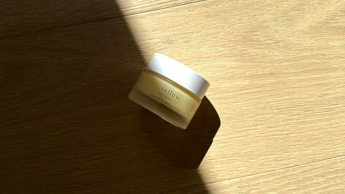 Organic tallow skincare: jar of Tallow and Honey Balm in warm afternoon sunlight
