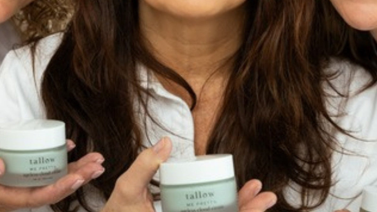 Tallow and holistic wellness: three smiling women in white shirts holding jars of Ageless Cloud Cream