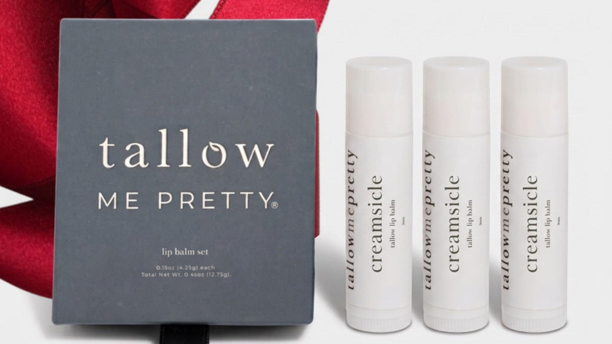 Christmas gifts for women: Creamsicle tallow lip balm set wrapped with a red ribbon