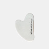 Simple morning skincare routine: white stone gua sha tool engraved with tallowmepretty