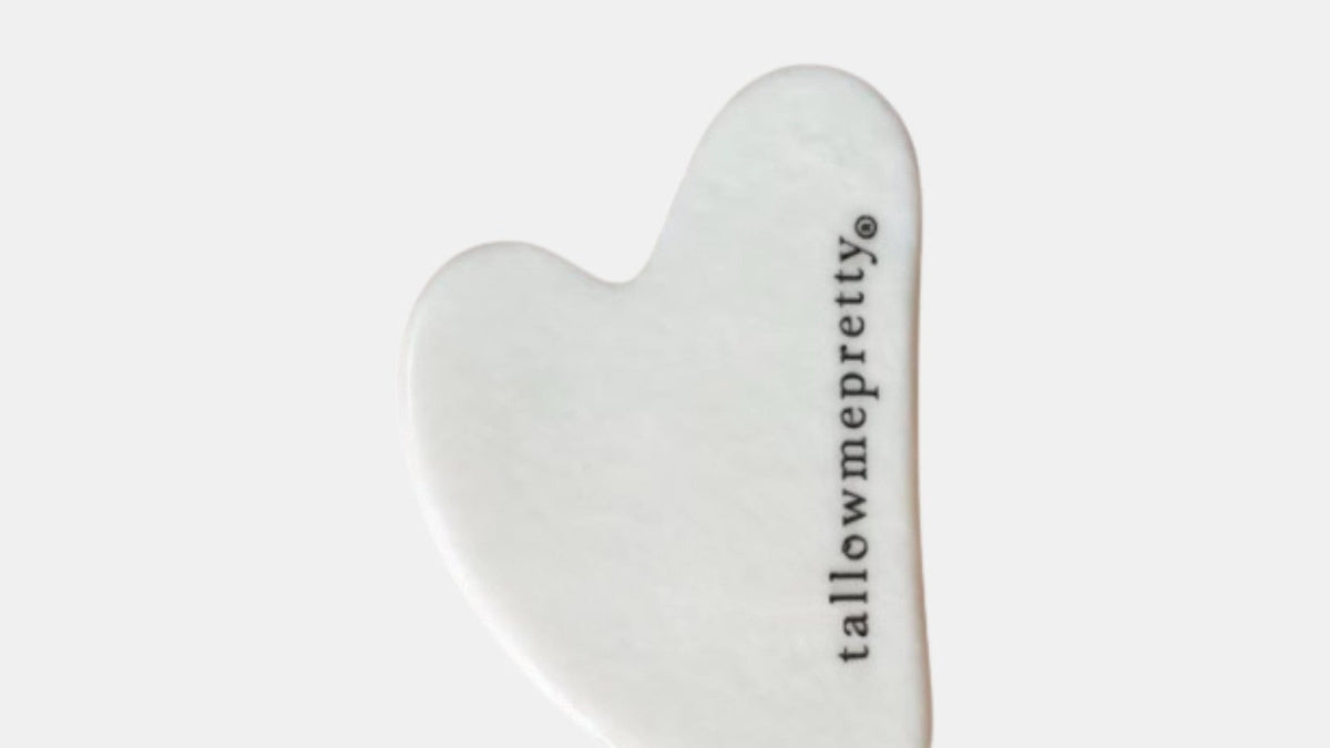How to add tallow cream to your routine: white stone gua sha tool engraved with tallowmepretty