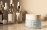 What to use beef tallow for on skin: Ageless Cloud Cream jar on a vanity beside glass serum bottles