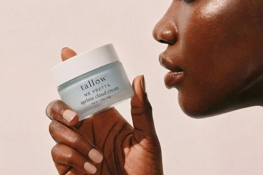 Does beef tallow help with wrinkles: woman holding a jar of Ageless Cloud Cream near her face