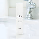 Elegant Tallow Me Pretty Herbal Chest Rub stick set against a modern bathroom background, designed for effortless application to aid in breathing relief and wellness.