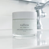 Elegantly designed Tallow Me Pretty Anti-Aging Cloud Cream jar on a serene bathroom counter, infused with organic sweet orange essential oil, offering a rejuvenating and nourishing treatment for ageless skin.