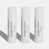 Three tallow me pretty peppermint lip balms on a white background