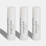 Three lip balm tubes from Tallow Me Pretty on a white background