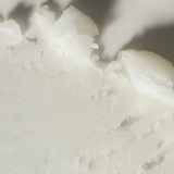 Close-up of Tallow Me Pretty Lavender Lip Balm with creamy, whipped texture, showcasing its nourishing and soothing qualities.