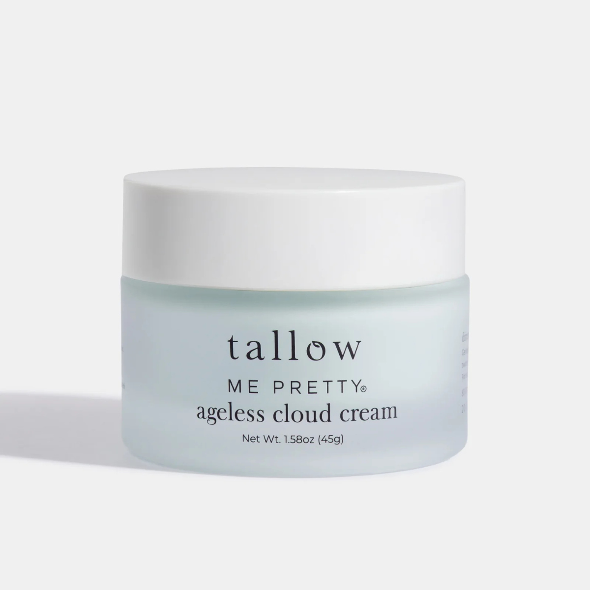 Frosted glass jar of Tallow Me Pretty Ageless Cloud Cream tallow moisturizer on white background
