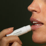 Applying Tallow Me Pretty Creamsicle Tallow Lip Balm to the lips, grass-fed tallow balm for dry chapped lips