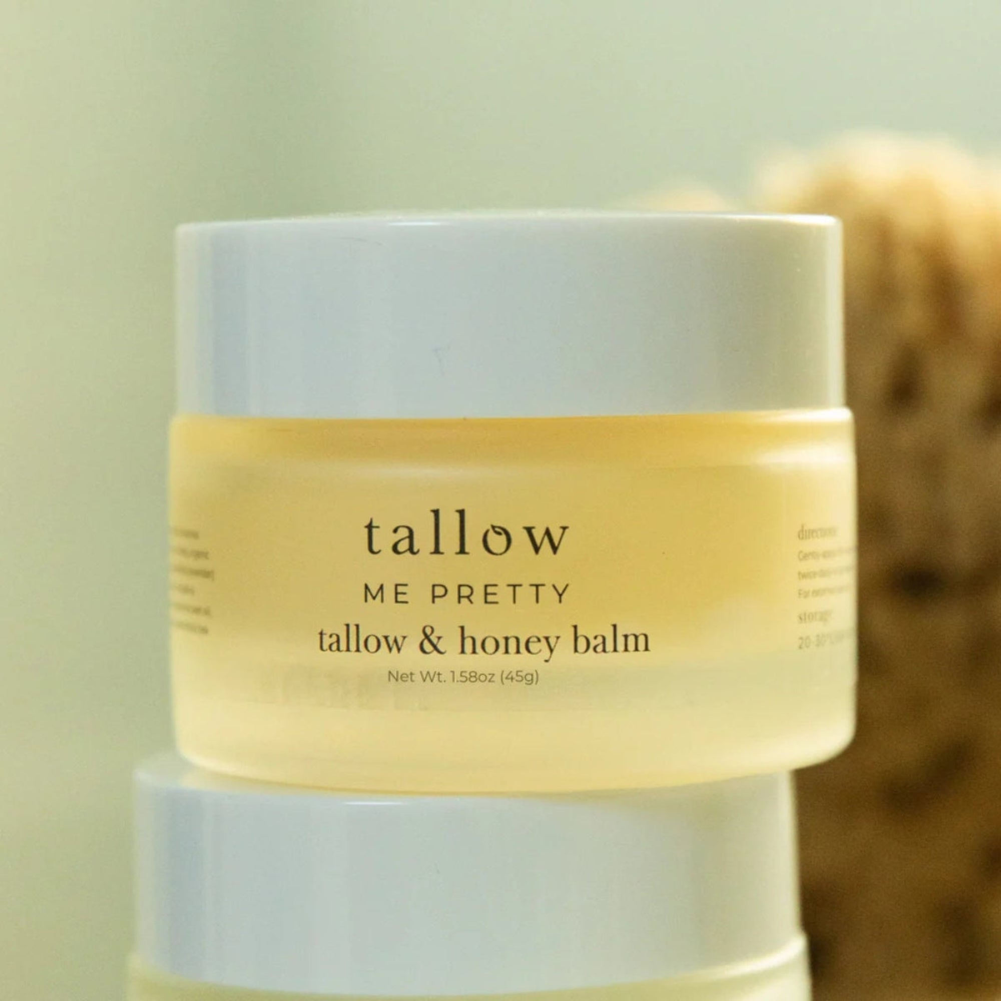 Tallow & Honey Balm jar stacked with a soft blurred background, showing natural skincare lifestyle aesthetic.