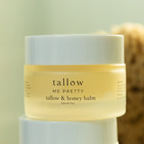 Jar of tallow and honey balm with a blurred background